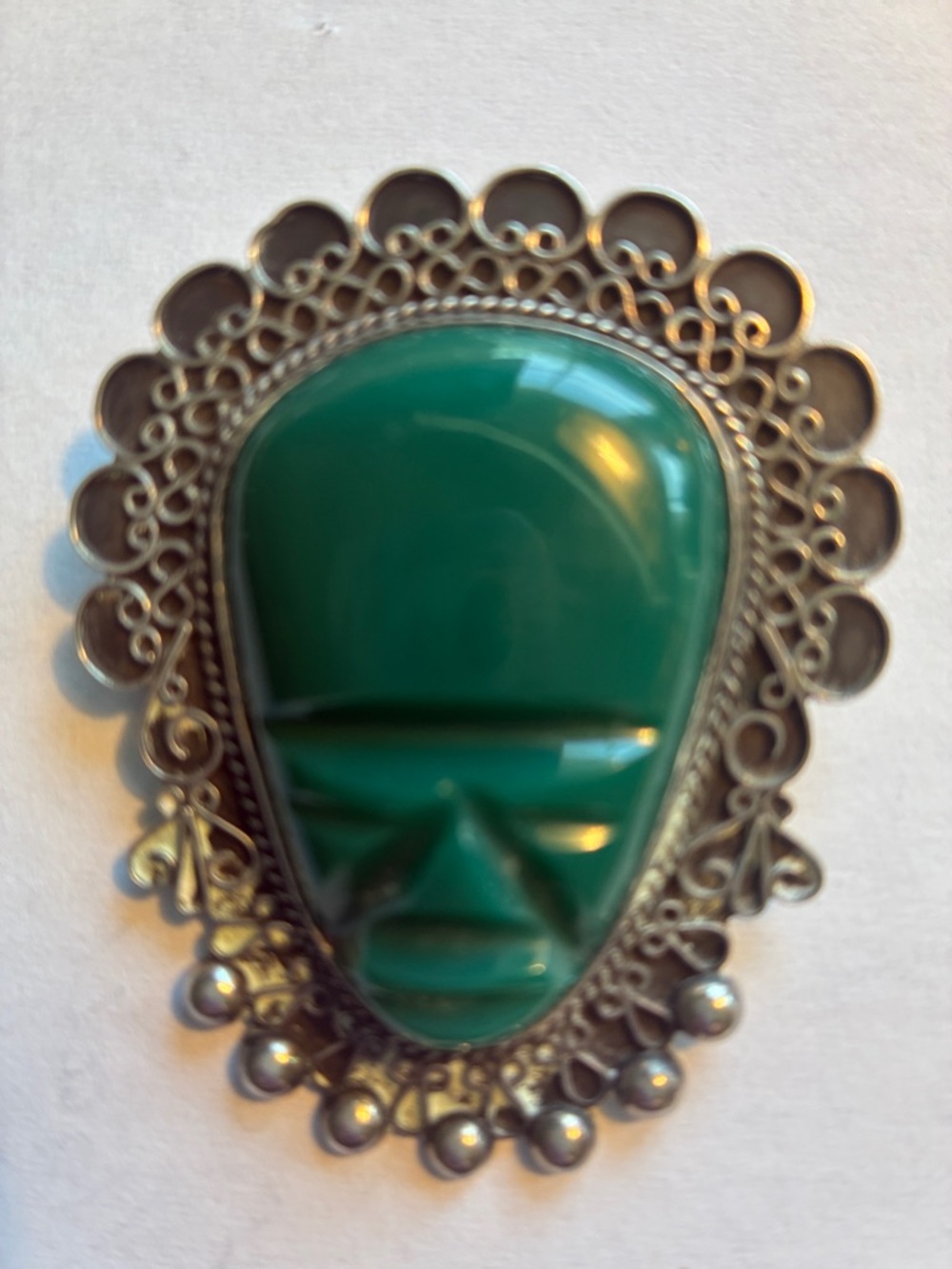 Vintage Mexican Sterling Brooch featuring a carved green stone